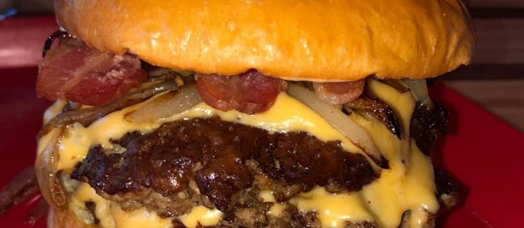 Smash burger with crispy bacon and sauteed onions Recipe Image
