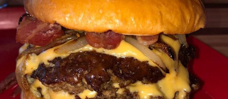 Smash burger with crispy bacon and sauteed onions Recipe Image