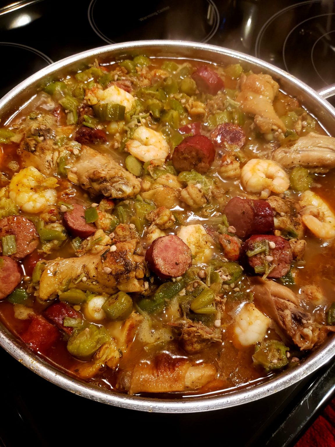 Okra stew with chicken, sausage, shrimp and crawfish tails, onion and green peppers