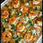 Cajun shrimp fried rice with scallions and egg